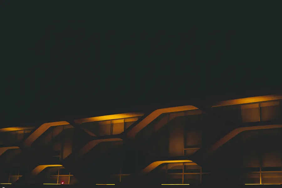 Corporate building facade lit at night
